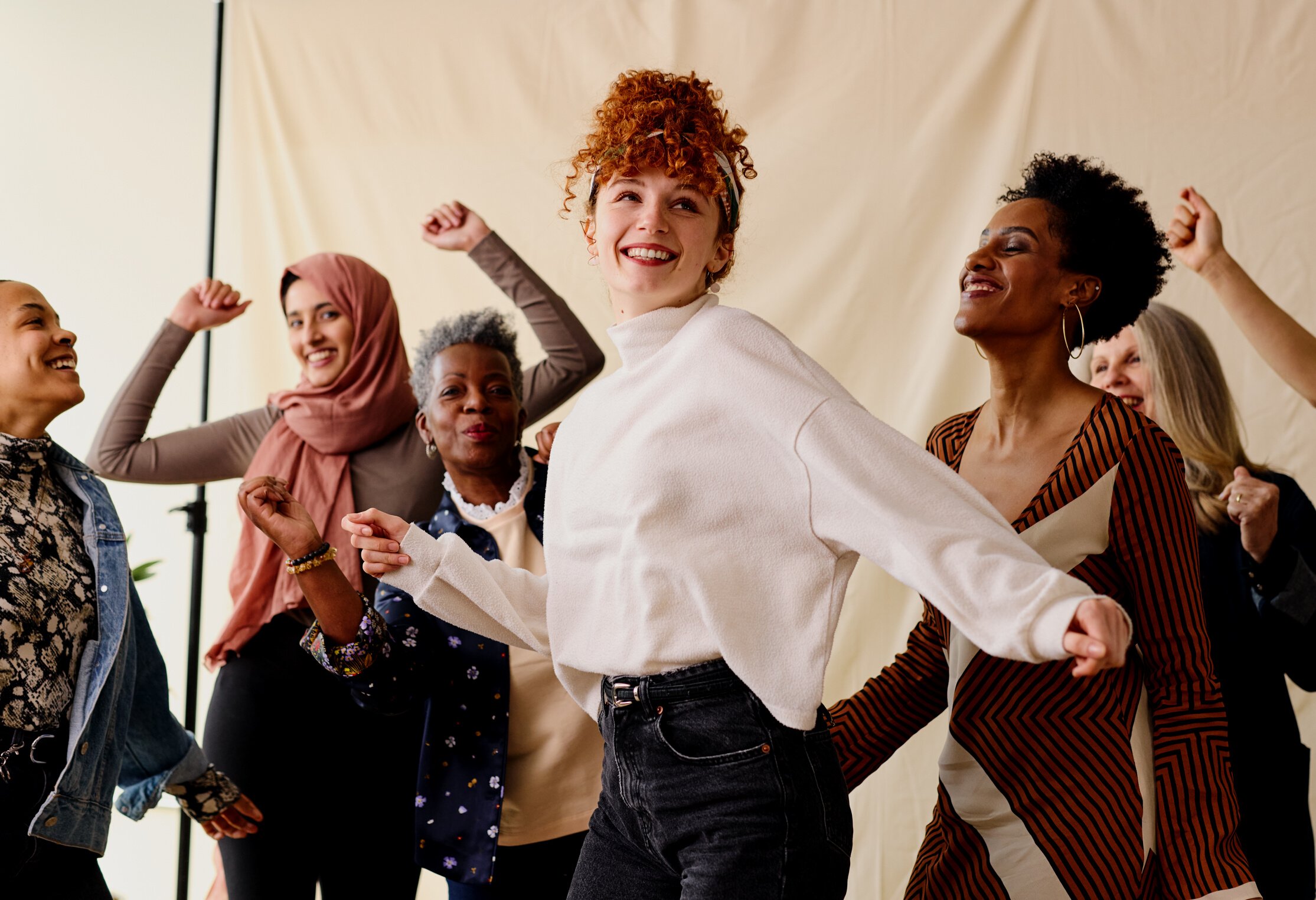 International Women's Day Candid Portrait of Multi Ethnic Mixed Age Range Women Dancing